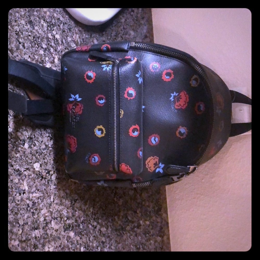 NewCoach backpack purse. Black with floral design